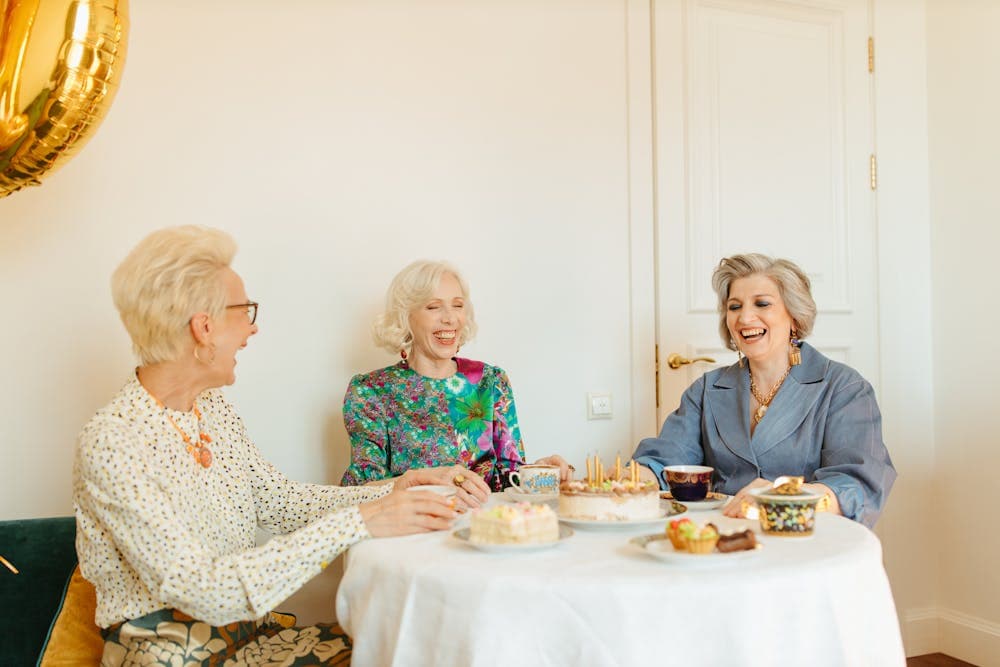 A warm, confident woman laughing with friends